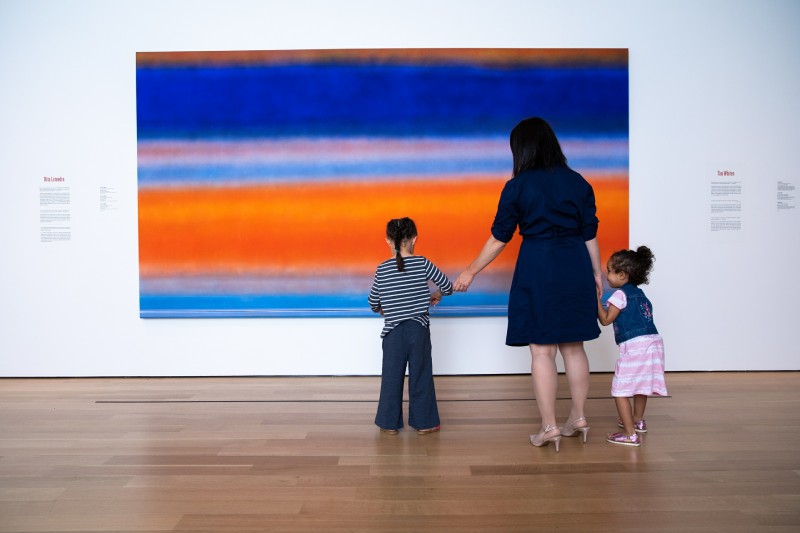 Family admiring Rita Letendre's Daybreak, 1983.