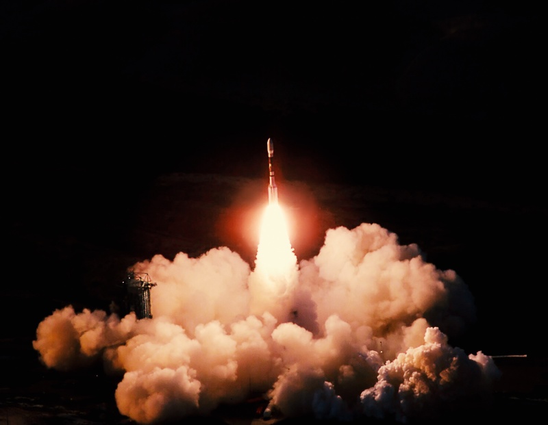 Rocket launch at night.